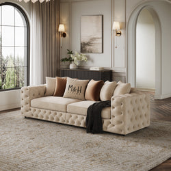 Ashton 4 Seater Sofa shown in plush velvet, angled view in a living room