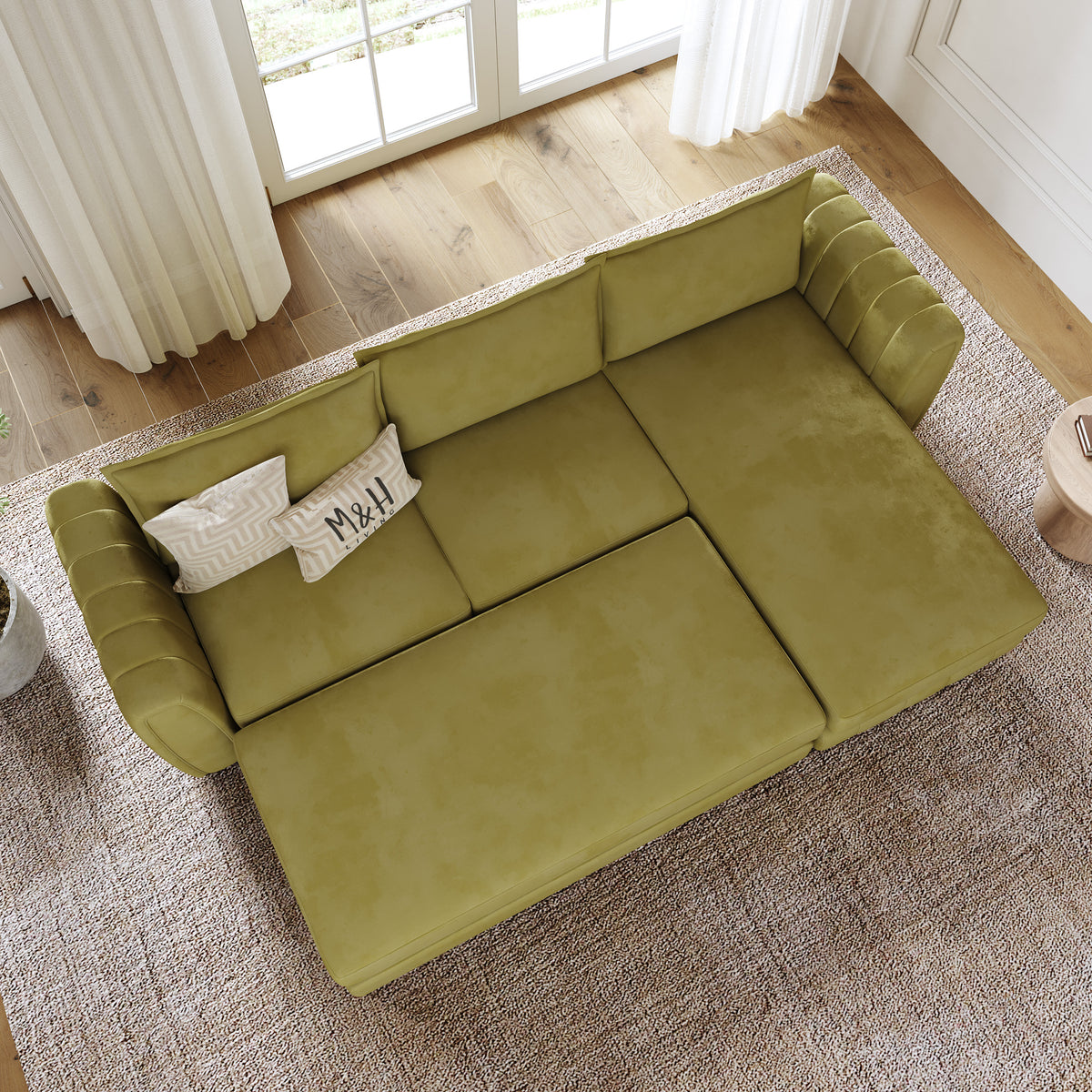 Hazel Convertible L Shape Sofa shown in plush velvet, overhead view in a living room