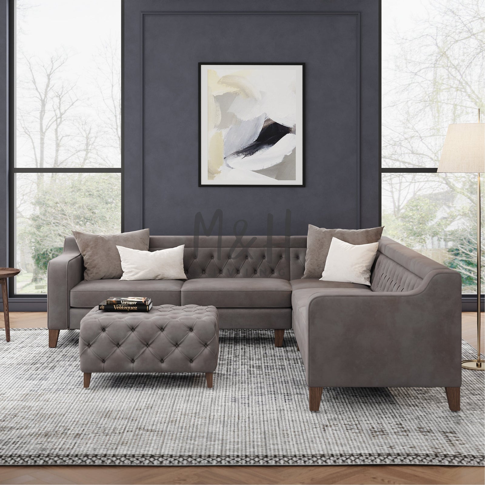 M&H Living showroom interior with grey sofas displayed in a bright space