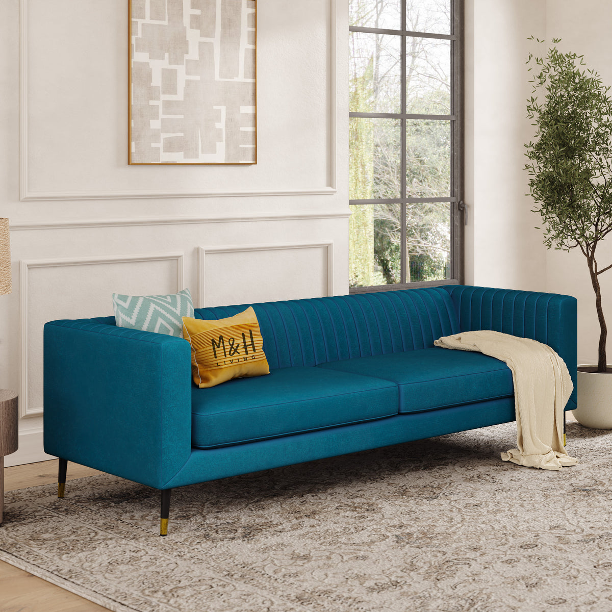 Monroe 3 Seater Sofa shown in plush velvet, angled view in a living room