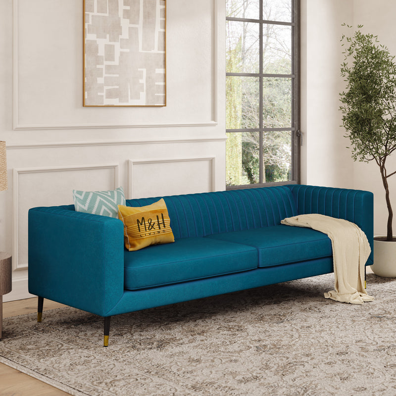 Monroe 4 Seater Sofa shown in plush velvet, angled view in a living room