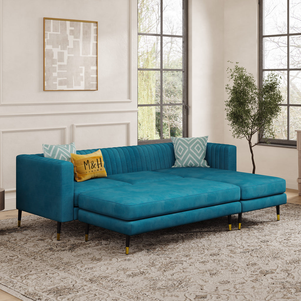 Monroe Convertible L Shape Sofa shown in plush velvet, angled view in a living room