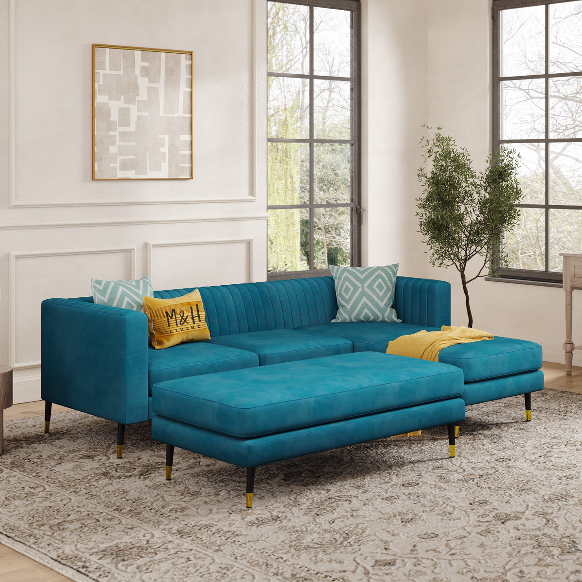 Monroe Convertible L Shape Sofa shown in plush velvet, angled view in a living room