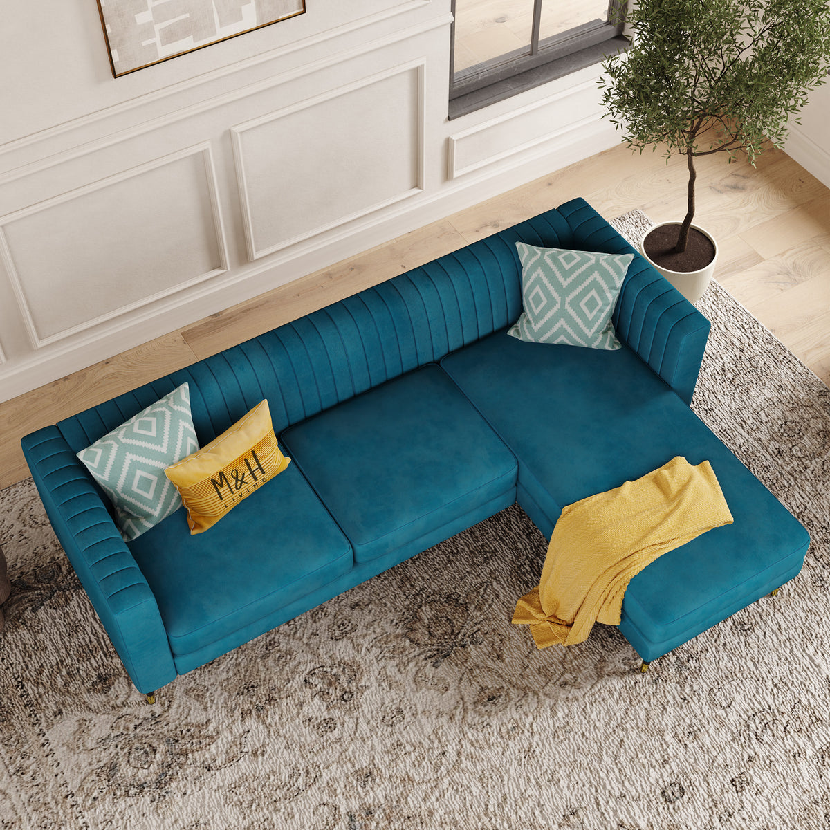 Monroe L Shape Sofa shown in plush velvet, overhead view in a living room