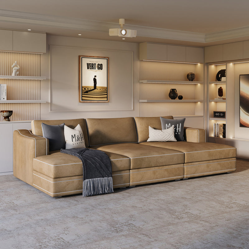 Odeon Home Cinema Sofa shown in plush velvet, angled view in a living room
